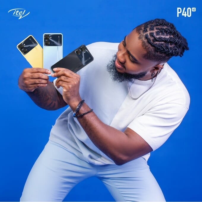Praise Nelson holding the itel P40 smartphone in three colours